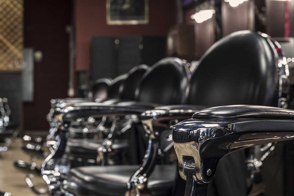 close up of vintage barber chairs